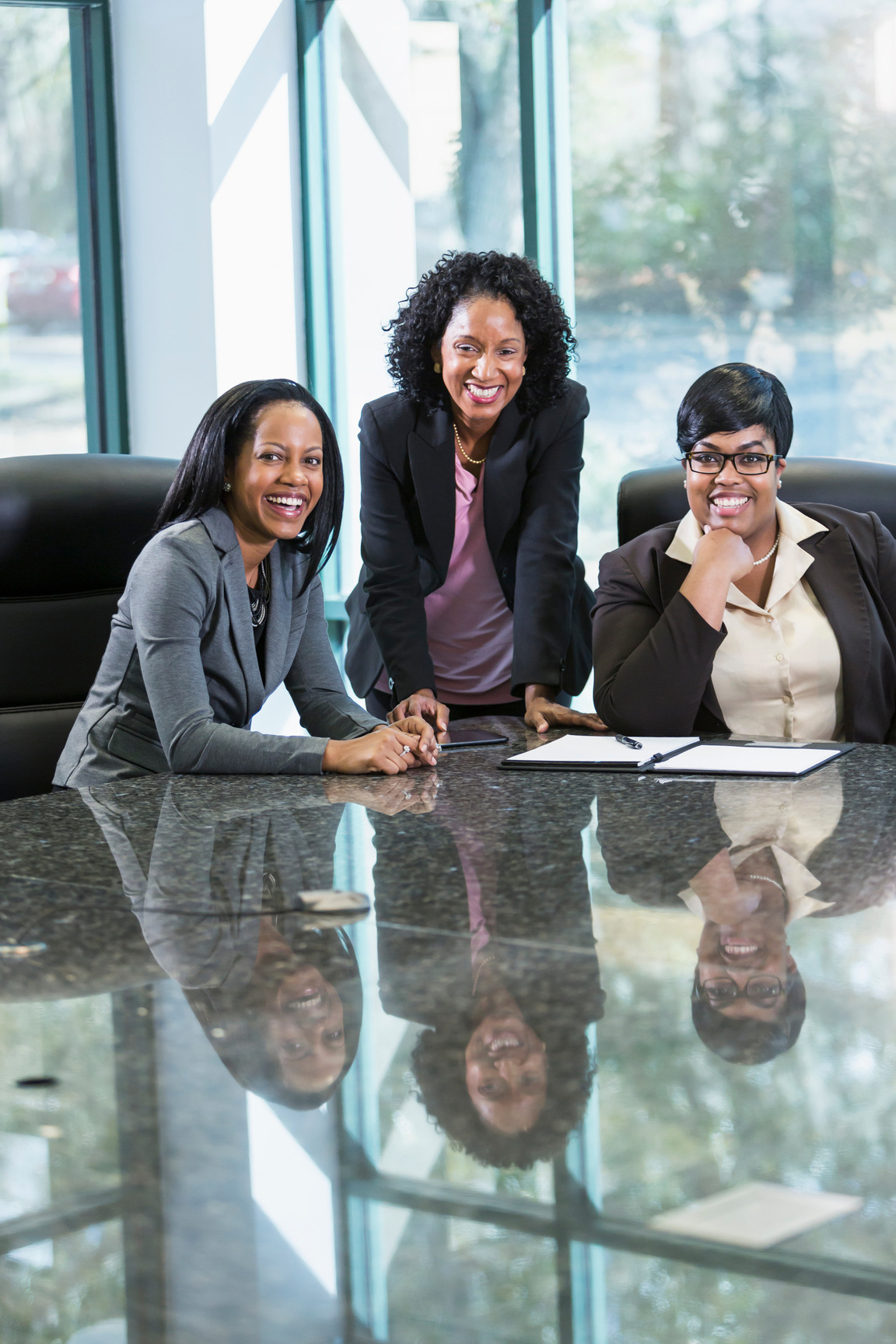 Three black women in business meeting